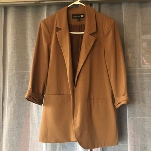 Tan long women’s blazer with shoulder pads